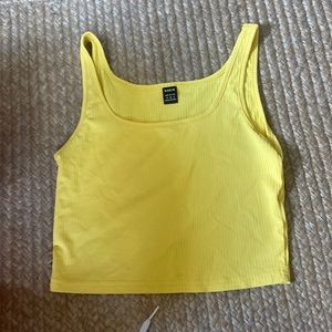 cropped yellow tank top, slightly see-through